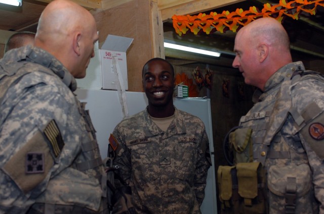 Lt. Gen. Raymond Odierno (left), Multi-National Corps-Iraq commanding general and Command Sgt. Maj. Neil Ciotola (right), the top noncommissioned officer for MNC-I, express their gratitude to the troops, like Trenton, N.J. native Pvt. Cedrick Ghant D...