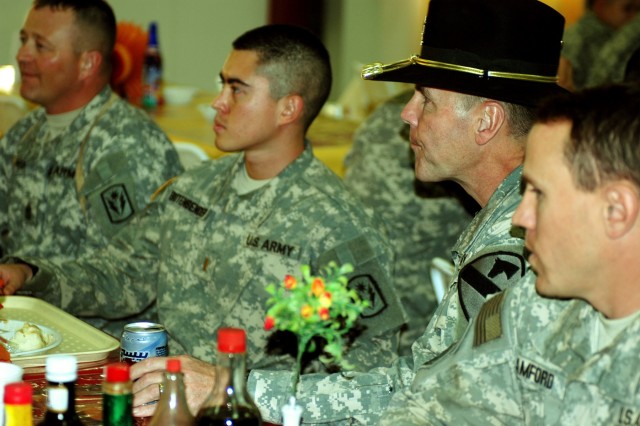 Maj. Gen. Joseph Fil, 1st Cavalry Division and Multi-National Division - Baghdad commanding general, talks with Soldiers over Thanksgiving dinner at a dining facility on Camp Taji, Iraq Nov 22. Fil spent Thanksgiving visiting Soldiers throughout...