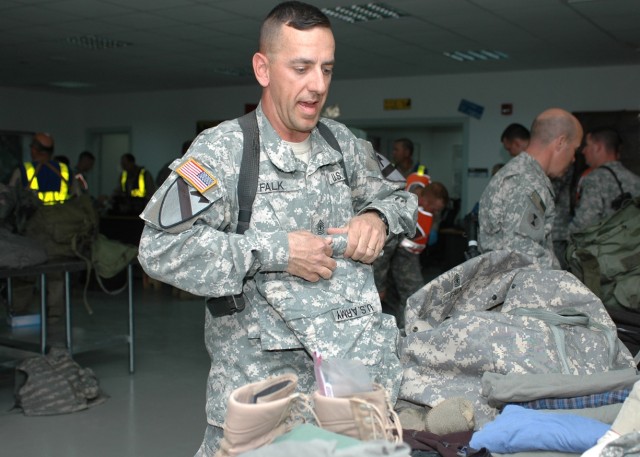 Boulder, Colo., native 1st Sgt. David Falk, the senior enlisted Soldier for Company C "Witch Doctors," 2nd Battalion, 227th Aviation Regiment, 1st Air Cavalry Brigade, 1st Cavalry Division, rolls up his clothes as he puts them back in his bag after a...