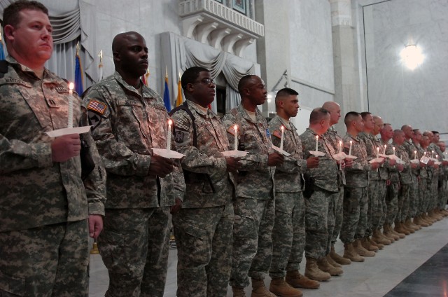 Soldiers of the 1st Cavalry Division and 138th Fires Brigade are inducted into the Order of St. Barbara in the Al-Faw Palace at Camp Victory in western Baghdad, Nov. 23. Due to St. Barbara's association with lightning, she has been invoked for...