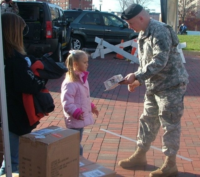 Sergeant hands out his own action figures at Army-Navy game