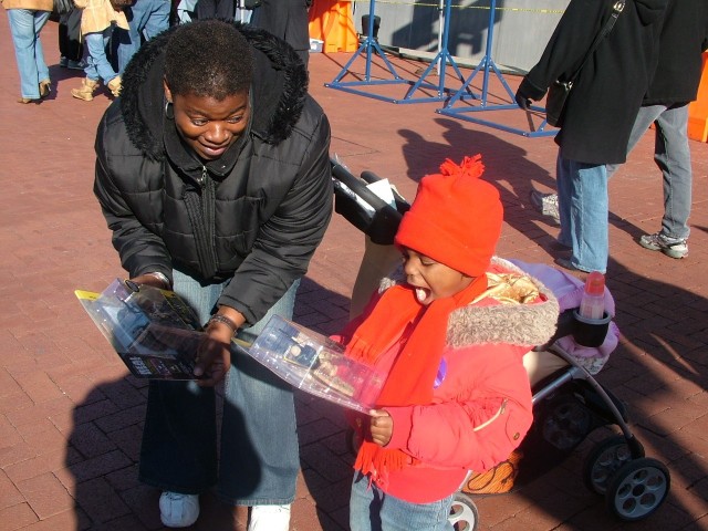 Sergeant hands out his own action figures at Army-Navy game