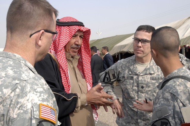 Col. Paul E. Funk II (left), commander of 1st Brigade Combat Team, 1st Cavalry Division discusses the advancements of security in the area with a local tribal leader and Lt. Col. Kurt Pinkerton, commander of 2nd Battalion, 5th Cavalry Regiment during...