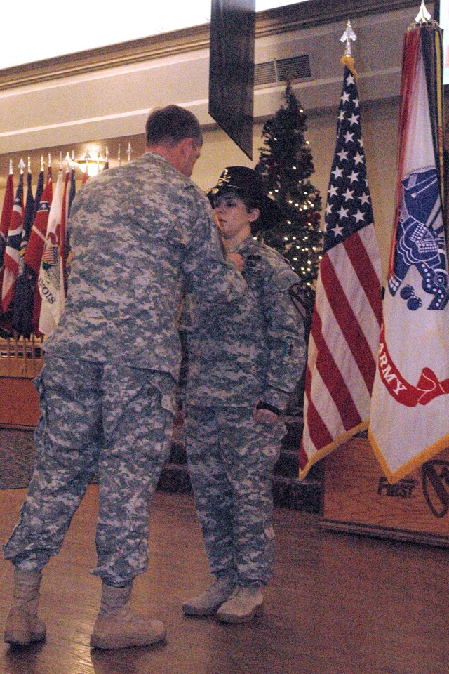 Col. Paul Wentz, the commander of the 13th Sustainment Command (Expeditionary), pins the Purple Heart Medal on Colorado Springs, Colo., native 1st Lt. Anna King-McCrilliss, with the 1st Battalion, 7th Cavalry Regiment, 1st Brigade Combat Team, 1st Ca...