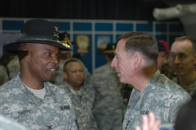Colonel Stephen Twitty, commander of the 4th Brigade Combat Team, 1st Cavalry Division (left), speaks with Gen. David Petraeus, commander of Multinational Forces - Iraq, following the brigade's transfer of authority ceremony at Forward Operating Base...