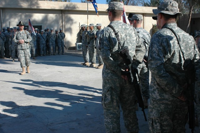 Lt. Col. Christopher Joslin, commander of 2nd "Lobo" Battalion, 227th Aviation Regiment, 1st Air Cavalry Brigade, 1st Cavalry Division, (left), addresses some of his Soldiers during a colors casing ceremony Dec. 10 at Taji, Iraq. Joslin told his...