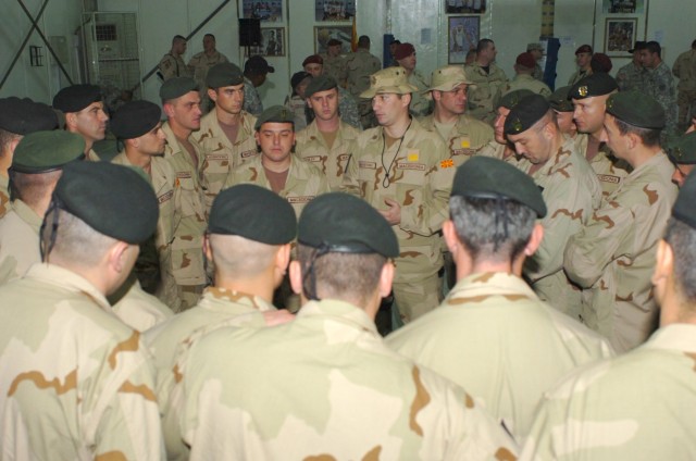 After a transfer of authority ceremony, incoming Macedonian troops from the Macedonian Rangers, Macedonian Special Forces Battalion, receive a briefing at Camp Taji, Iraq Dec. 12 from Macedonian Maj. Marjan Jachevski (center), the Macedonian liaison ...