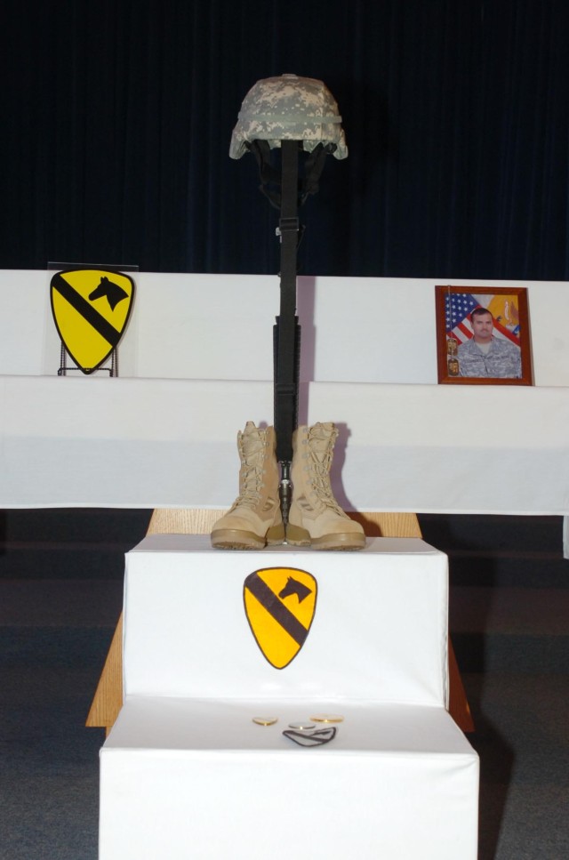 A Soldier's Cross stands in tribute to the memory of Sgt. Alfred Paredez with Headquarters and Headquarters Company, 1st Battalion, 8th Cavalry Regiment, 2nd Brigade Combat Team, during a memorial ceremony held at the 1st Cavalry Division Memorial...