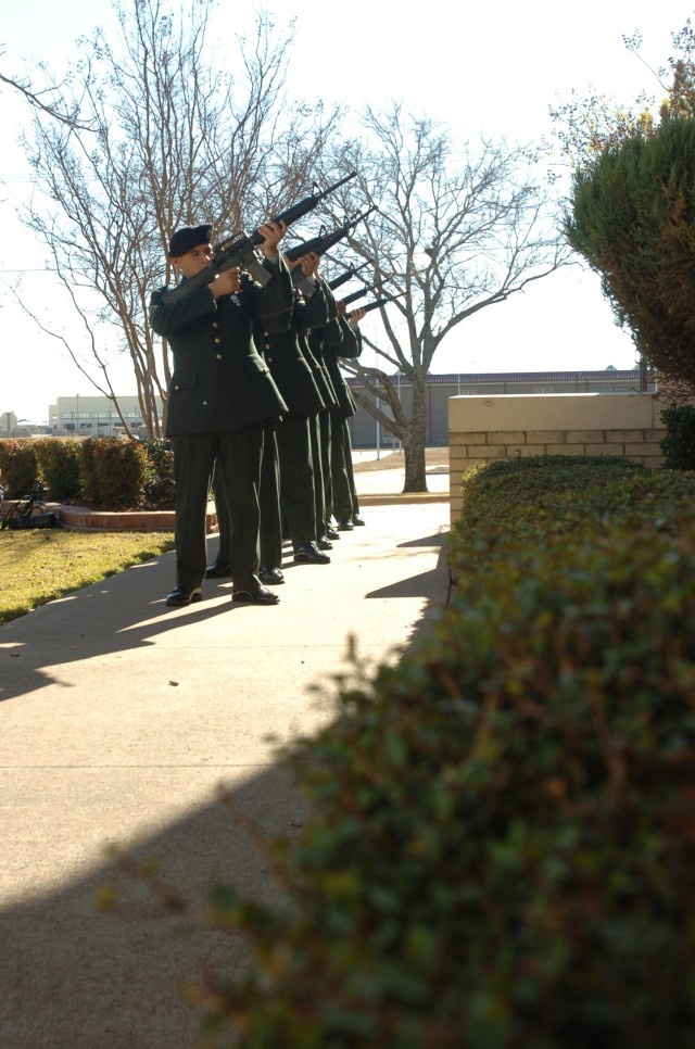 Soldiers out of Fort Hood, Texas, pay tribute to the memory of Sgt. Alfred Paredez of Las Vegas, Nev., during a memorial ceremony held at the 1st Cavalry Division Chapel Dec. 20. The Soldier with Headquarters and Headquarters Company, 1st...