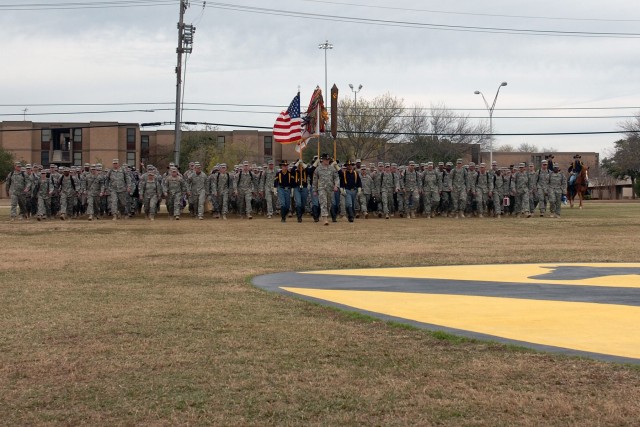 Approximately 220 troopers from the 1st Cavalry Division's 1st Air Cavalry Brigade, led by Traverse City, Mich., native Col. Daniel Shanahan, the brigade's commander, march across Cooper Field to their loved one, who were waiting in  the stands, foll...
