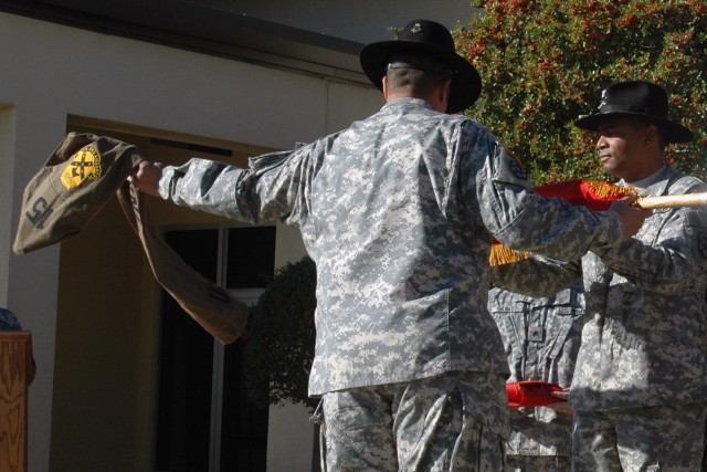 Command Sgt. Maj. Mark Joseph, the senior noncommissioned officer for the 15th Sustainment Brigade, uncases the Brigade colors with Col. Aundre Piggee, the 15th SB commander, during the uncasing ceremony held Dec. 13 at the brigade headquarters on...