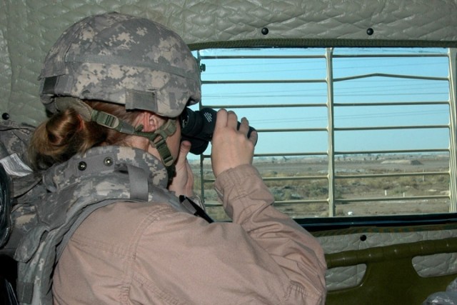 CAMP TAJI, Iraq --  Jonesboro, Ga. native Spc. Ceason Westbrook, a medic with the 1st Brigade Special Troops Battalion assigned as a member of a Buffalo Mine Resistant Vehicle crew, scans a route north of Baghdad, searching for improvised...