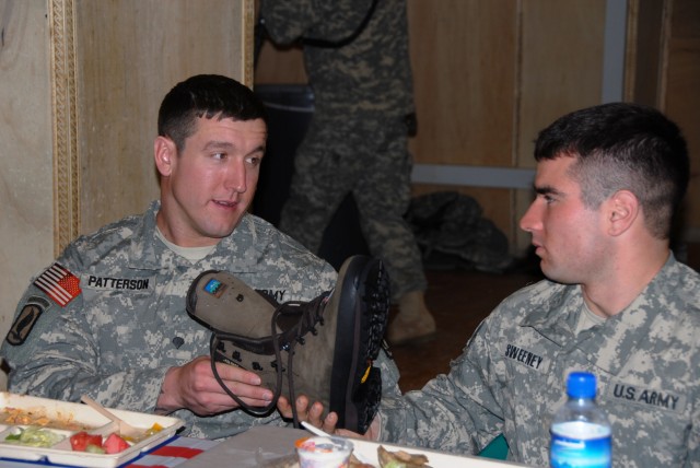 AMC CG visits FOBs in Afghanistan, reenlists 3 Soldiers