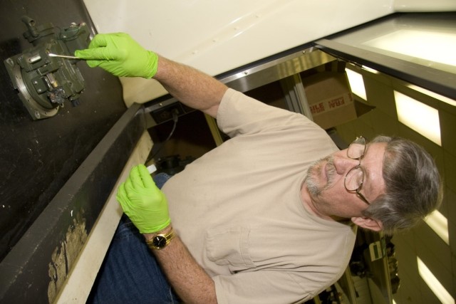 Optics repairers in tritium room seeing fewer radioactive sources
