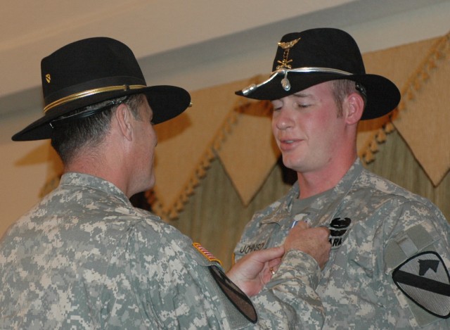 Chief Warrant Officer 3 Zachary Johnson,  a pilot with 4th Battalion, 227th Aviation Regiment, 1st Cavalry Division, gets pinned with the Distinguished Flying Cross by Maj. Gen. Joseph F. Fil, Jr., the 1st Cavalry Division's commanding general...