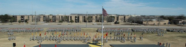 Soldiers of the 1st Cavalry Division stand in formation in front of the division's headquarters on Fort Hood, Texas, during Maj. Gen. (P) Joseph F. Fil, Jr.'s relinquishment of command ceremony and the uncasing ceremony Feb. 1. The outgoing...