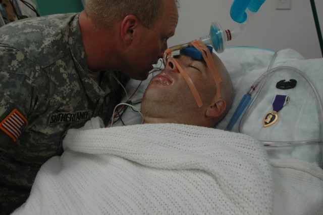 Col. David Sutherland, commander of the 3rd "Grey Wolf" Brigade Combat Team, 1st Cavalry Division, leans in to speak to Maj. Dominique Dionne, commander of the 1st Battalion, 2nd Brigade, 5th Iraqi Army Military Transition Team, attached to 3rd...