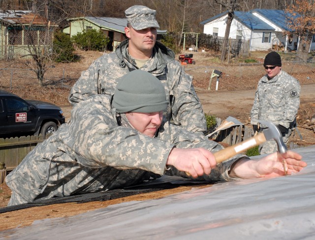 Soldiers Repair Tornado-damaged Roof