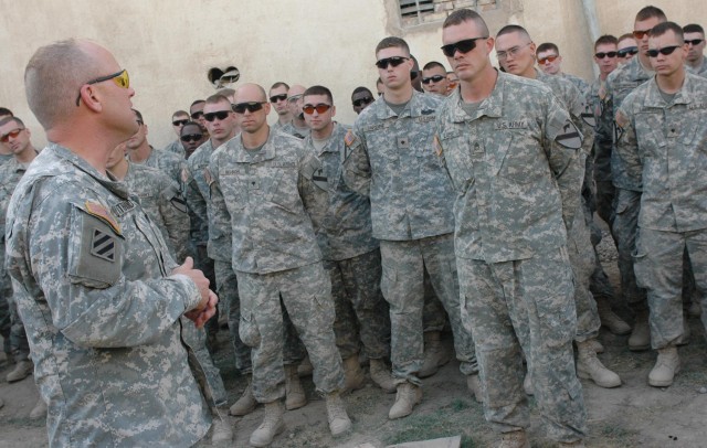 Following the end of tour award ceremony for the Soldiers of "Bone" Company, 1st Squadron, 12th Combined Arms Battalion, 3rd Brigade Combat Team, 1st Cavalry Division, Oct. 24, Col. David W. Sutherland, "Grey Wolf" Brigade commander, speaks to the...