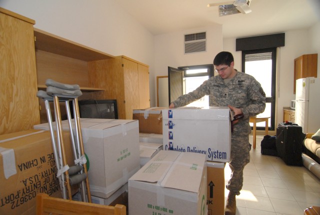 Sgt. Justin Varnes moves into one of the new single rooms in the WTU barracks.