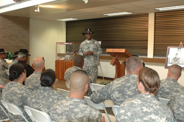 Lt. Col. Barry Dickerson, the 1st Cavalry Division's Equal Opportunity Program manager, tells Soldiers gathered in the division's headquarters on Fort Hood, Texas, how Black History Month was created during an observance Feb.21. Retired Command Sgt. ...