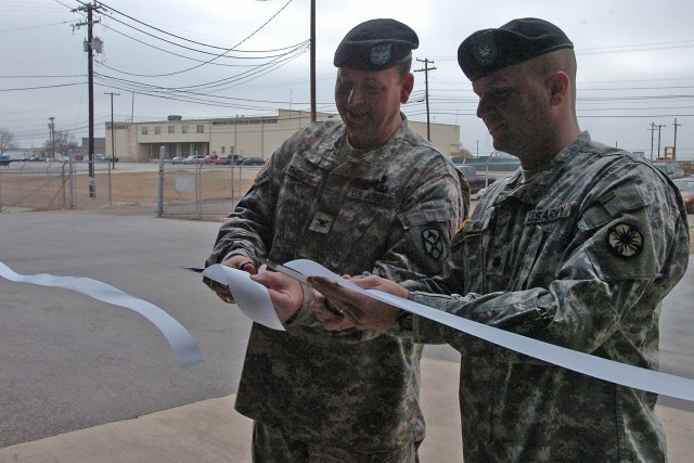 Col. Larry Phelps, the commander of the 13th Sustainment Command (Expeditionary)'s 15th Sustainment Brigade and Lt. Col. Peter Haas, the commander of the brigade's 49th Transportation Battalion, cut the ribbon on Fort Hood's new Class III package war...