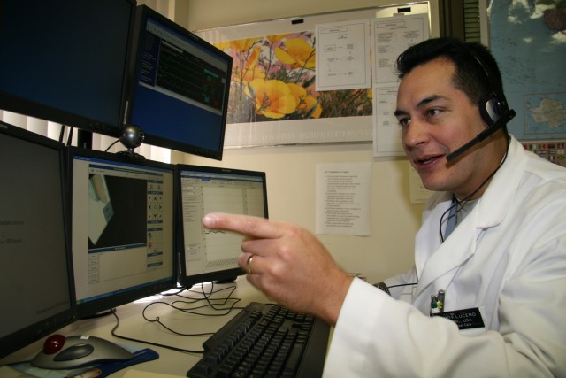 Maj. (Dr.) Pedro Lucero, eICU consultant, explains the capability of the telemedicine system installed here, the first of its kind at military medical centers.