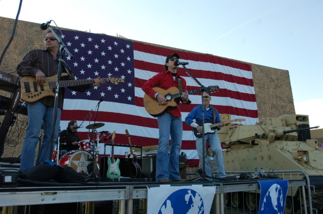 Granger Smith and his band perform for troops at a rally prior to Vice President Richard Cheney's speech on the 1st Cavalry Division's parade field on Fort Hood, Texas, Feb. 26. Smith took the opportunity to thank Soldiers for their service, since...