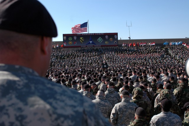 Joliet, Ill. native Sgt. Donald Davis (left), a transportation noncommissioned officer for Company A, 115th Brigade Support Battalion, 1st Brigade Combat Team, 1st Cavalry Division listens and watches intently to Vice President Richard Cheney,...