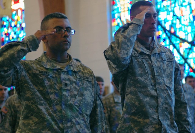 Soldiers with the 3rd Squadron, 8th Combined Arms Battalion, 3rd Brigade Combat Team, 1st Cavalry Division, salute their fallen comrades one last time during a memorial ceremony for the battalion at the First Team Chapel, Feb. 15.  3-8 CAB lost eight...