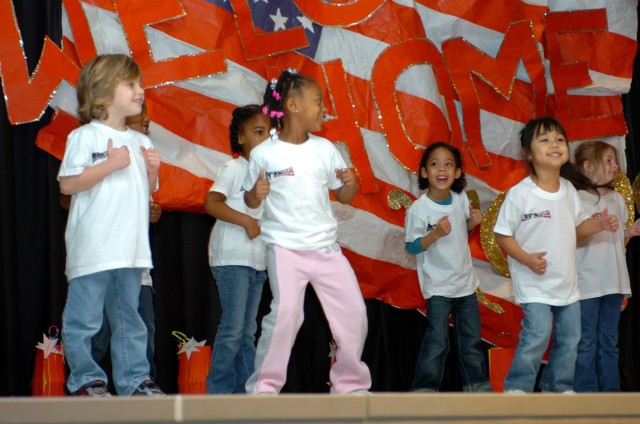 Pre-kindergarten students from Trimmier Elementary School do a dance routine to entertain troops during a welcome home ceremony Feb. 22. Soldiers from the 4th "Guns" Battalion, 227th Aviation Regiment, 1st Air Cavalry Brigade, 1st Cavalry...