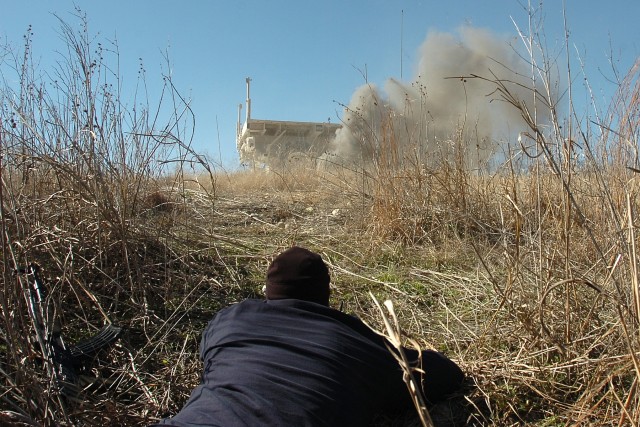Spc. Joseph Halliday, a driver with the 96th Transportation Company, 180th Transportation Battalion, 15th Sustainment Brigade, 13th Sustainment Command (Expeditionary), sets off a simulated improvised explosive device as a convoy from the 602nd...