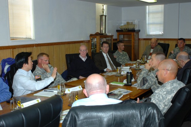 In a meeting between senior leadership of the 1st Brigade Combat Team, 1st Cavalry Division and members of the Army Science Board, Kwan Kwok (left), an advisor with the Army Science Board, addresses Col. Paul E. Funk II (upper far right), commander, ...