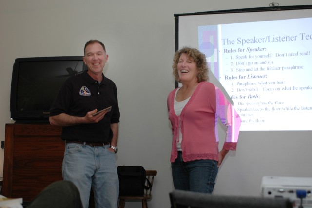 Col. Joe McKeon (left), director of aero-medical proponency for Army Aviation, and his wife Jane (right), demonstrate how to utilize the speaker/listener technique at the 1st Air Cavalry Brigade, 1st Cavalry Division, senior leader Strong Bonds confe...