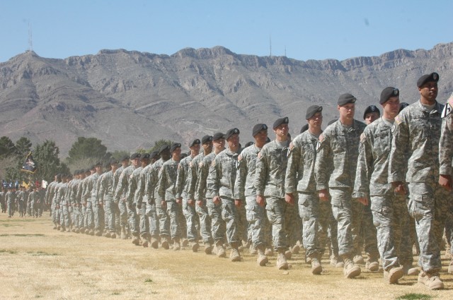 Soldiers from the 4th Brigade Combat Team, 1st Armored Division, march past the review stand during a reflag ceremony at Noel Field, March 4. The ceremony marked the end of the 1st Cavalry Division's time at Fort Bliss, Texas, and the beginning of...