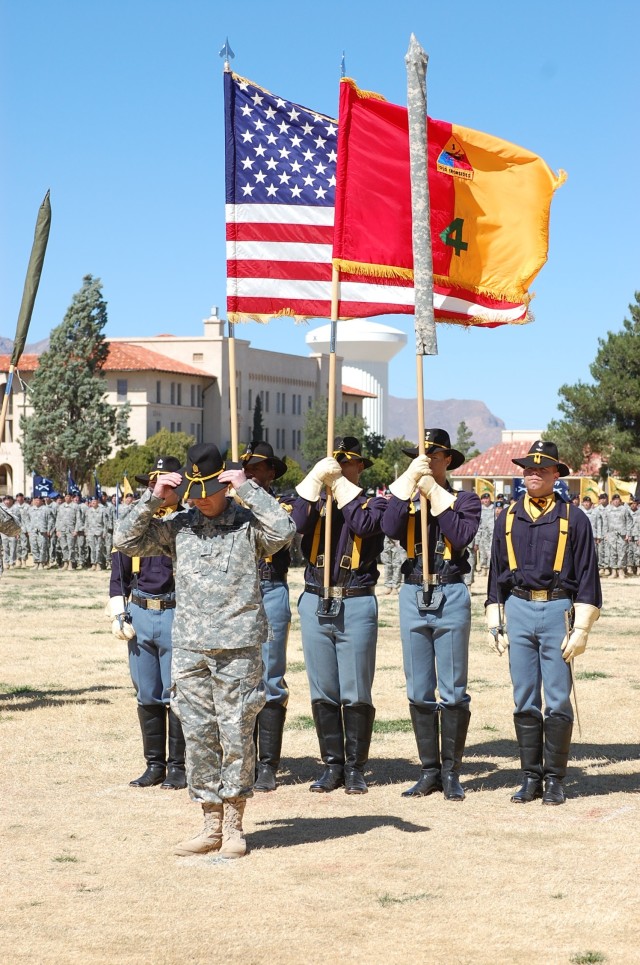 Command Sgt. Maj. Stephan Frennier, 4th Brigade Combat Team, 1st Armored Division prepares to remove his Stetson to signify the end of the 4th BCT, 1st Cavalry Division at Fort Bliss, Texas. The Long Knife Brigade re-flagged to the Highlander...