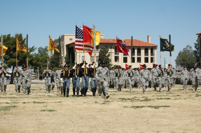 Col. Stephen Twitty, commander of the 4th Brigade Combat Team, 1st Armored Division leads the assembled Soldiers of the 4th Brigade Combat Team, 1st Cavalry Division as they prepare to case their colors and re-flag to the 4th BCT, 1st Armored...