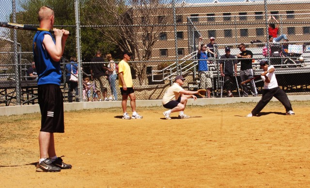 Soldiers from the 2nd Brigade Special Troops Battalion, 2nd Brigade Combat Team, 1st Cavalry Division, take part in a softball tournament at Delgado Field March 5 during their battalion's fun, which was designed to help them reintegrate back into...