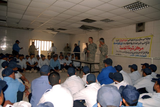 Military Police Soldiers provide on-the-job training for new Iraqi policemen