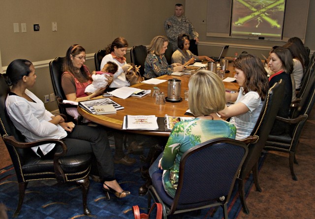 Lt. Col. Timothy Daugherty, 5th Battalion, 82nd Field Artillery Regiment commander, gives a presentation to military Family members during the battalion's pre-deployment offsite training in Austin. The 4th Brigade Combat Team, 1st Cavalry Division, i...