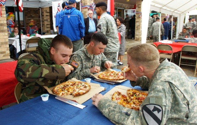 From Left: Pvt. Jeff Benoit, a Franklin Ark., native; Spc. Christian Hundertmark from Baltimore; and Temple, Texas native Pfc. Keenan McCoy, all from Company E, 1st Battalion, 5th Cavalry Regiment, 2nd Brigade Combat Team, 1st Cavalry Division, eat s...