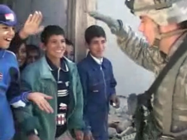 Soldier and Iraqi Children