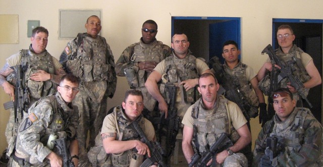 Soldiers of 3rd Platoon, Company D, 2nd Battalion, 8th Cavalry Regiment, 1st Brigade Combat Team, 1st Cavalry Division regroup after hours of relentlessly defending Joint Security Station Tarmiyah, Iraq on Feb. 19, 2007. Sgt. 1st Class Freddie...