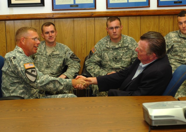 Lt. Col. Kevin MacWatters (left), commander, 1st Squadron, 7th Cavalry Regiment thanks Joseph L. Galloway, noted author and journalist, for his visit with the squadron's troops at the squadron's headquarters March 26. Galloway spent time as an embedd...