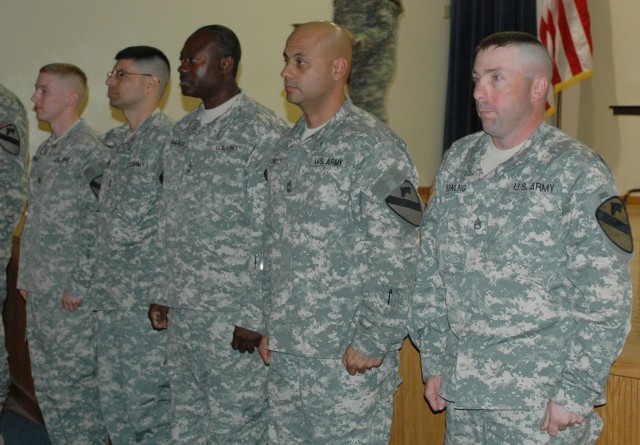 (From left to right) Maj. Edward Kendall, 1st Cavalry Division communications section or "G-6" networking officer; Chief Warrant Officer 3 David Banks, G-6 network management technician; Master Sgt. Anthony Marcus, G-6 network operations...