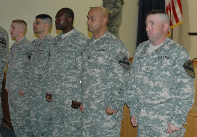 (From left to right) Maj. Edward Kendall, 1st Cavalry Division communications section or "G-6" networking officer; Chief Warrant Officer 3 David Banks, G-6 network management technician; Master Sgt. Anthony Marcus, G-6 network operations noncommissio...