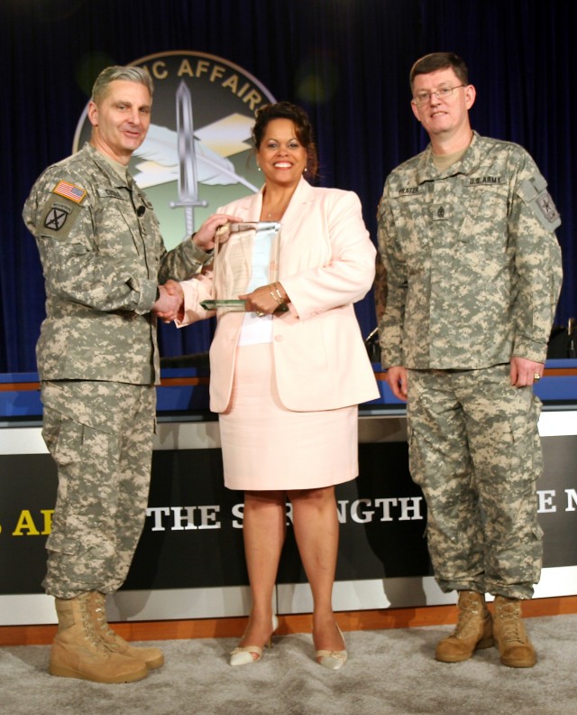 Army Chief of Public Affairs Maj. Gen. Tony Cucolo (left) and Sgt. Maj. Phil Prater (right) present Bonita Riddley with the first place award for excellence in community relations special events April 1 at the 2008 Worldwide Public Affairs...