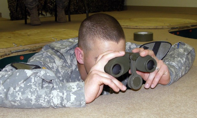 Pfc. Lucas Viers, a native of Indianola, Iowa, with the 3rd Battalion, 8th Cavalry Regiment, 3rd Brigade Combat Team, 1st Cavalry Division, examines terrain at an Observe Fire Trainer during a brigade competition March, 20. Viers ended up winning...
