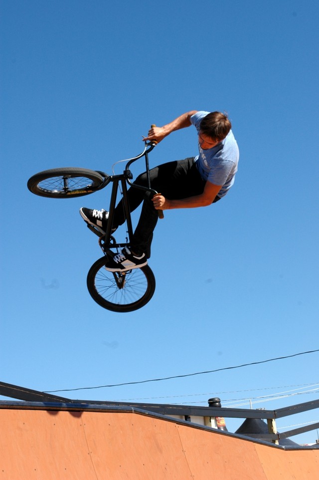 Professional BMX rider Kevin Porter puts on a show for Soldiers and their families during the 'Salute to Our Heroes' event at Fort Hood, Texas April 11. Along with BMX riders there were professional skateboarders flying through the air to entertain t...