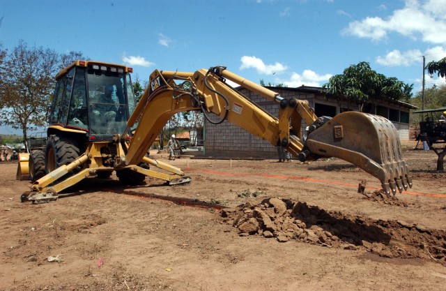 LAS MESAS, Honduras - Army Sgt. Jose G. Colon of the 756th Engineer Company from Ceiba, Puerto Rico, digs out the site of a new lavatory in Honduras during Beyond the Horizon 2008. Host unit Joint Task Force-Bravo has issued more than 8,000...